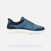 Blue athletic shoe on a light gray background