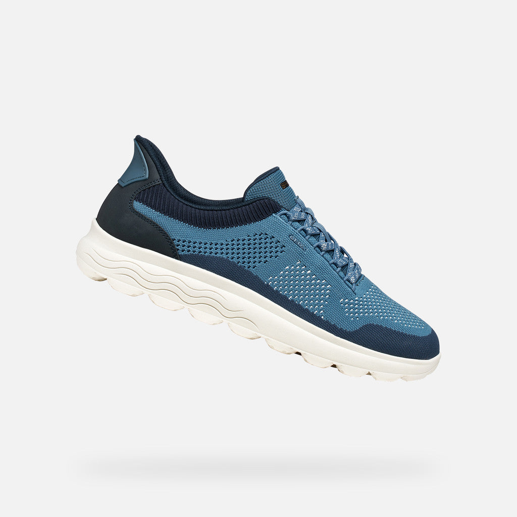 Blue athletic shoe on a white background