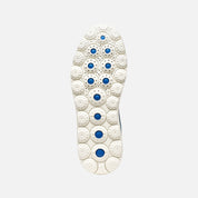 White shoe sole with blue accents on a light gray background