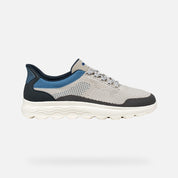 Gray and blue athletic shoe on a white background