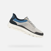 Gray and blue athletic shoe on a white background