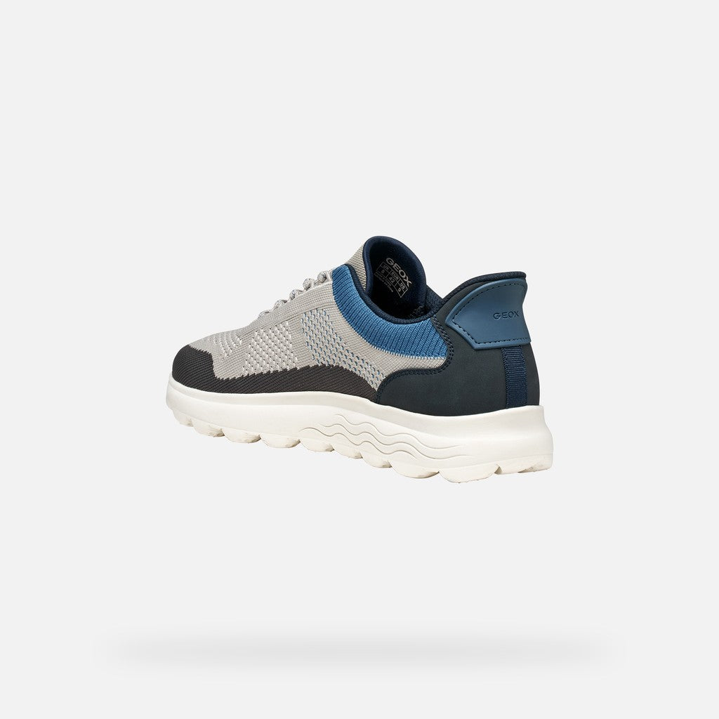 Sneaker with gray and blue design on a white background