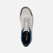 White sneaker with blue accents on a white background