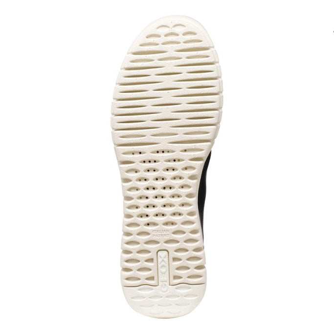 Close-up of a white shoe sole on a white background