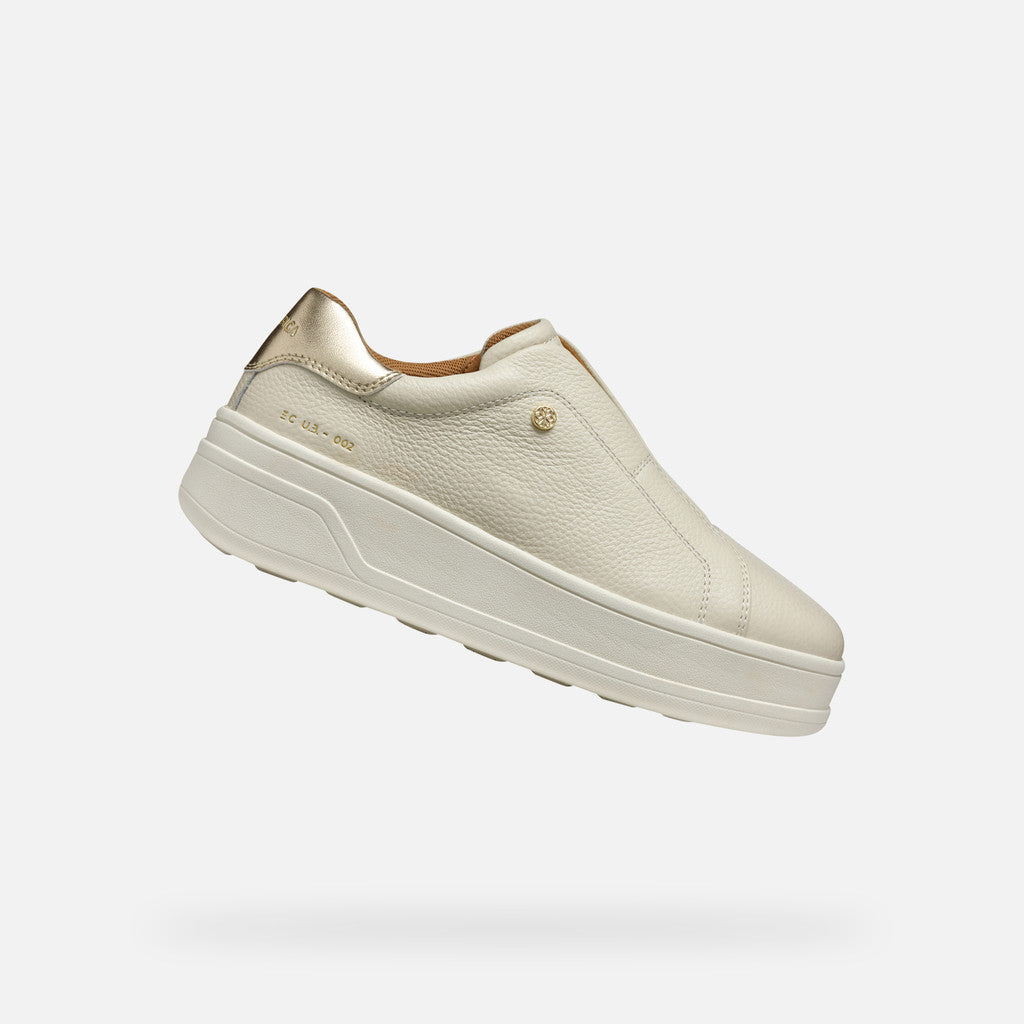 Beige sneaker on a light gray background