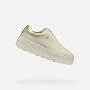 Beige sneaker on a light gray background