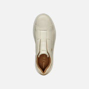 Beige slip-on sneaker with Geox branding on a white background