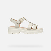 cream sandal with a platform sole on a light gray background