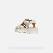 cream sandal with a platform sole on a white background