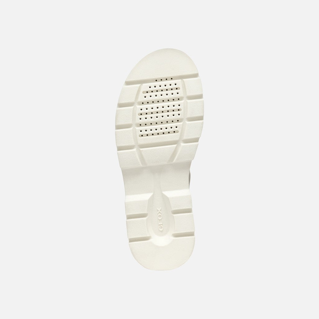 White sole of a shoe on a light gray background