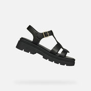 Black sandal with a thick sole on a white background