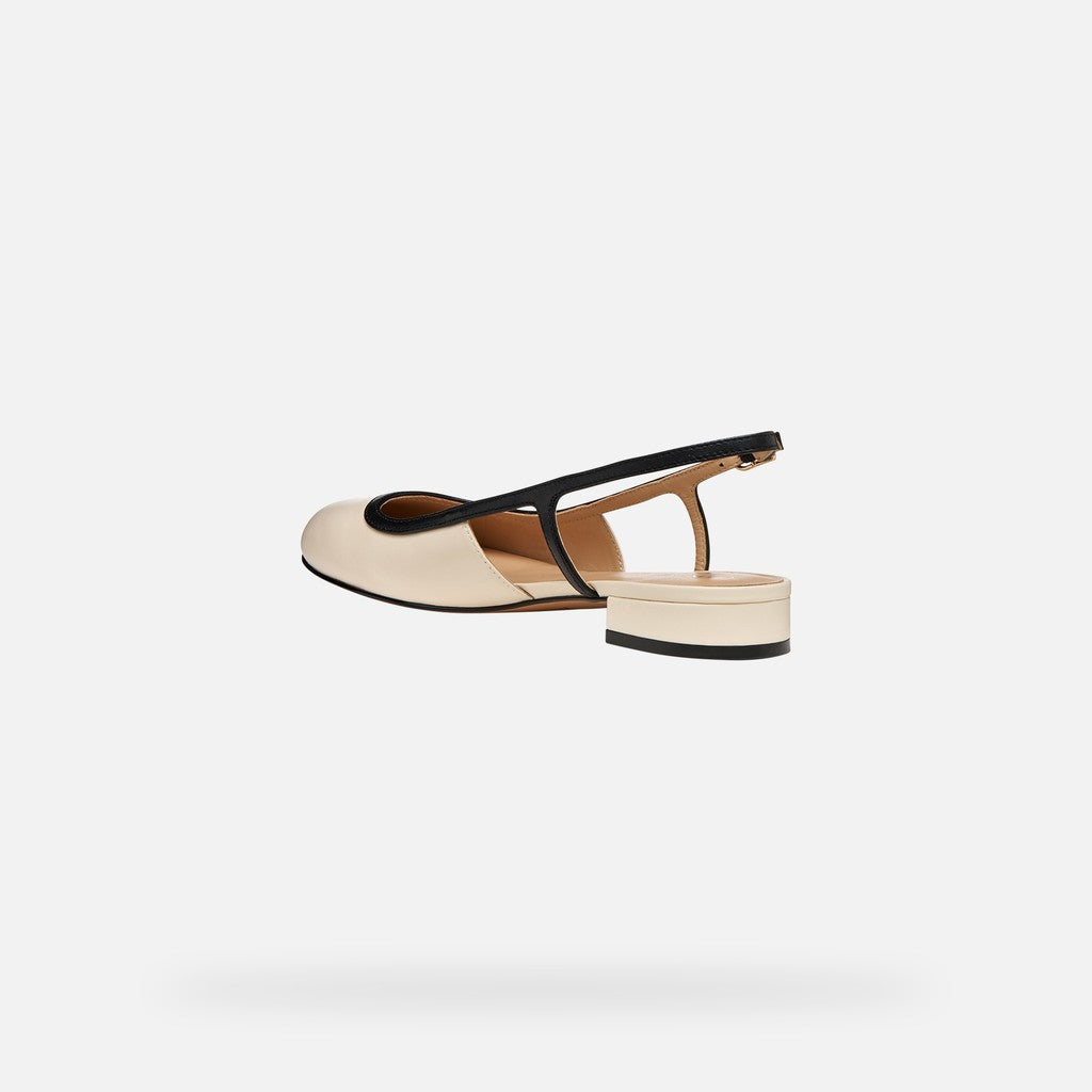Beige sandal with black strap on a white background