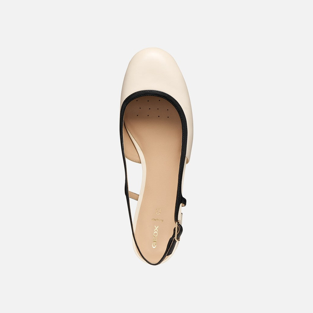 Beige sandal with black strap on a white background