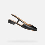 Black slingback shoe on a light gray background