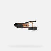 Black sandal on a light gray background