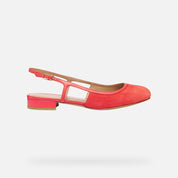 Coral sandal with a strap on a light gray background