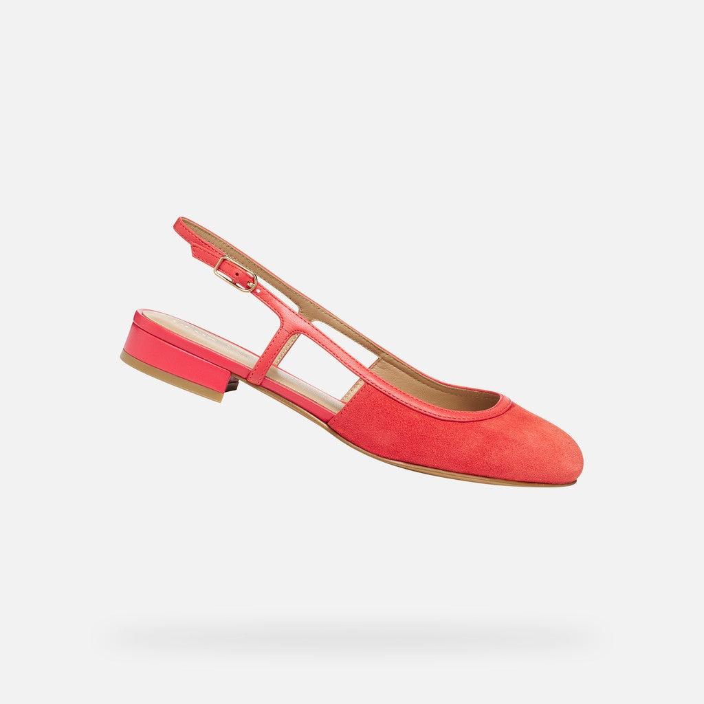 coral flat shoe with a slingback design on a light gray background