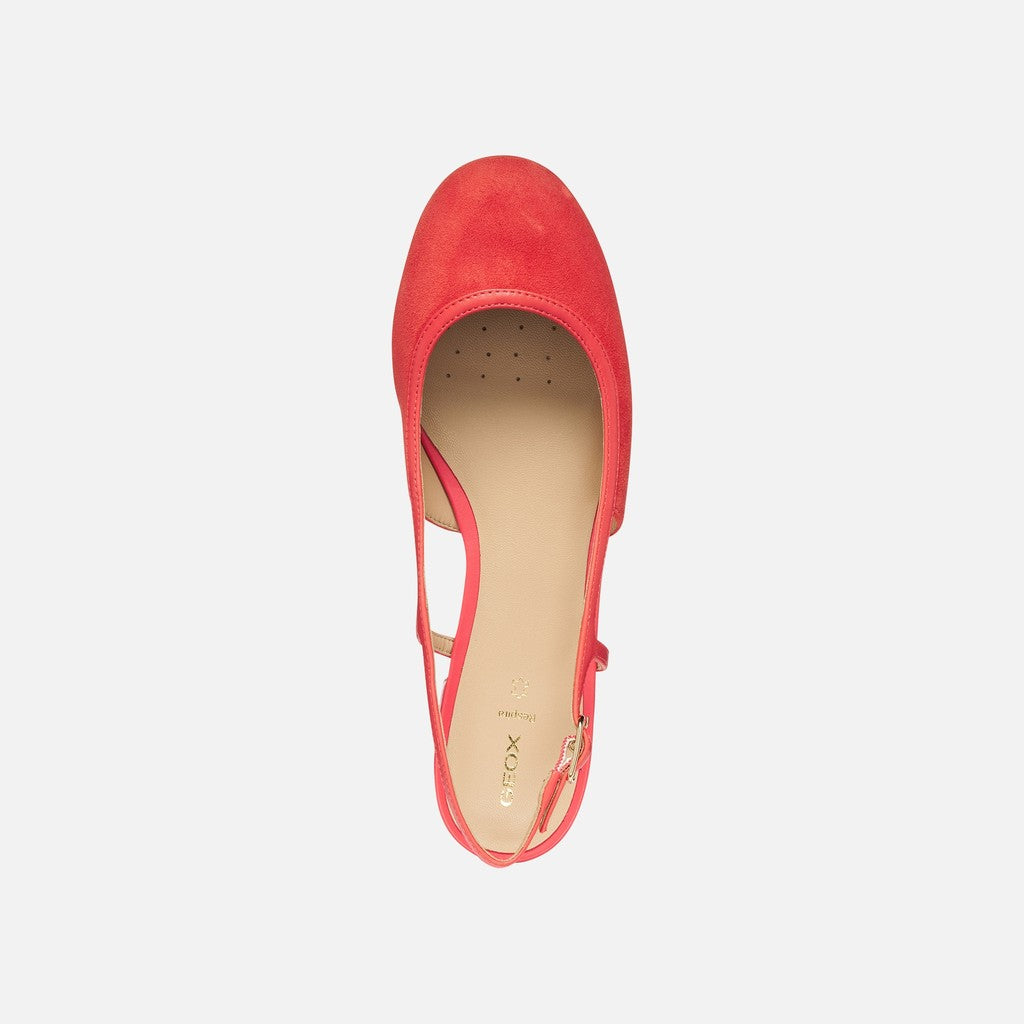 Coral slingback on a light gray background