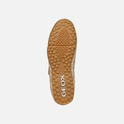 Geox shoe sole with brand logo on a light gray background