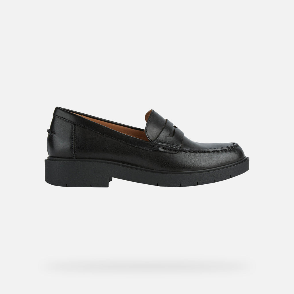 Black loafer shoe on a white background
