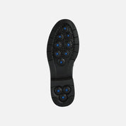 Black shoe sole with blue accents on a white background