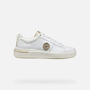 White sneaker with gold accents on a light gray background