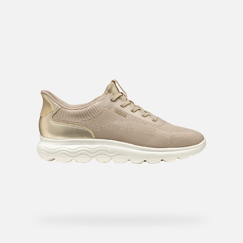 Beige sneaker on a light gray background
