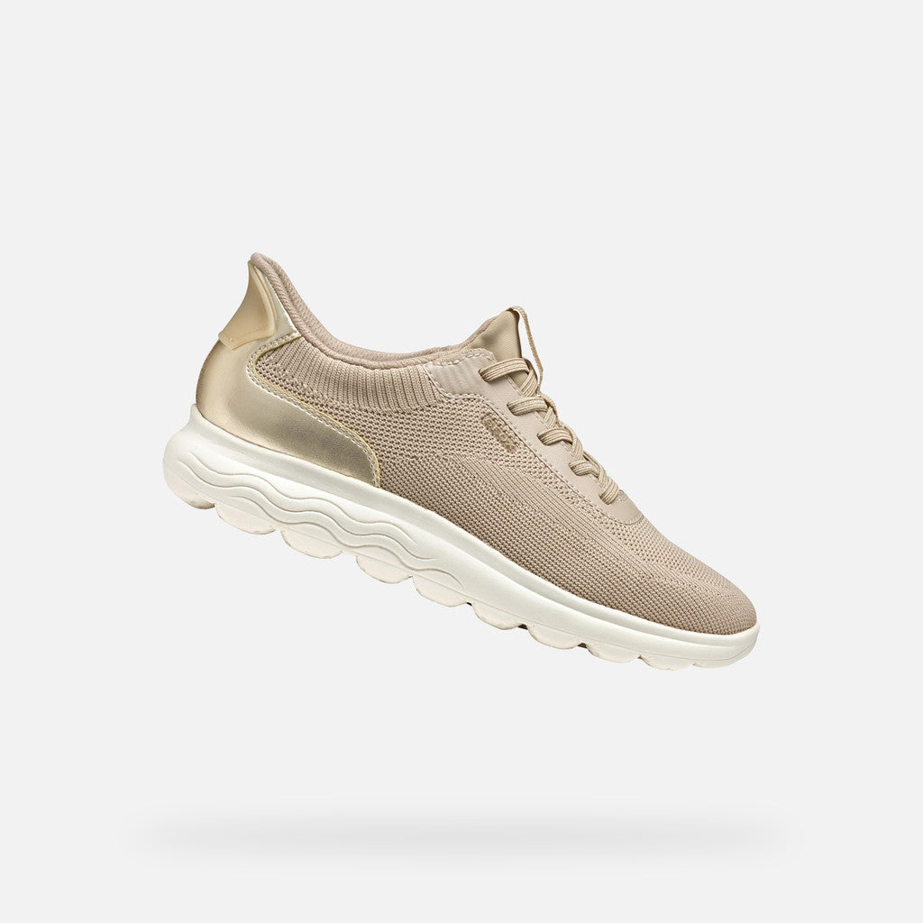 Beige sneaker on a white background