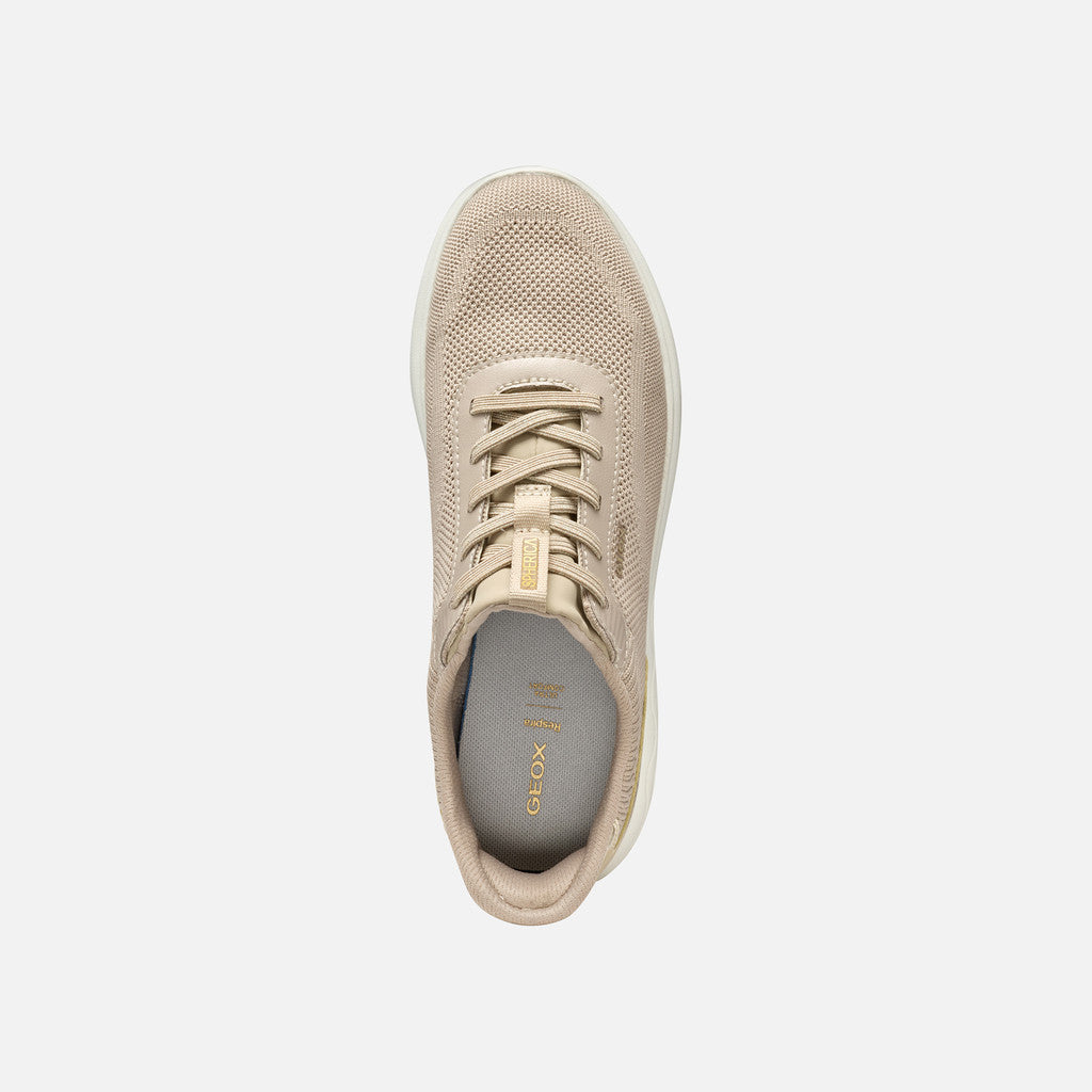 Beige sneaker on a light gray background