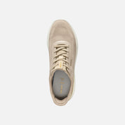 Beige sneaker on a light gray background