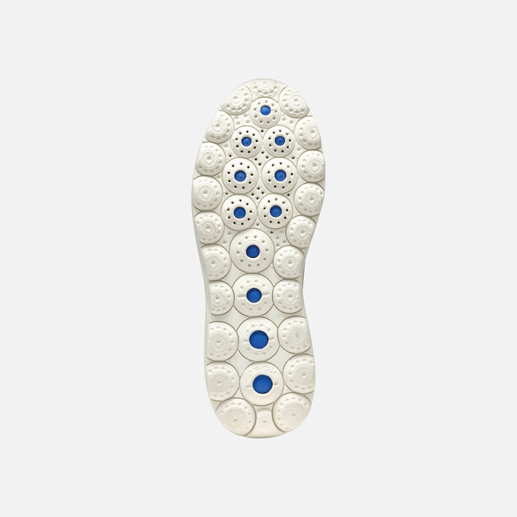 White shoe insole with blue accents on a light gray background
