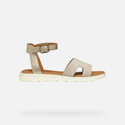 Beige sandal with a strap on a white background