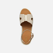 Beige sandal with a tan insole on a white background