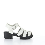 Silver sandal with a black sole on a white background
