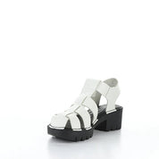 White sandal with black sole on a white background