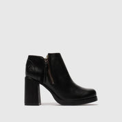 Black ankle boot with a block heel on a white background