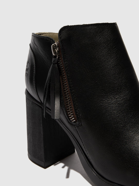 Black leather ankle boot with a block heel on a light gray background