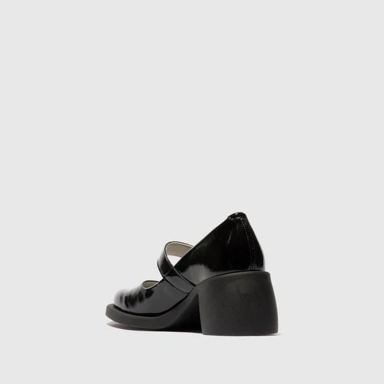 Black mary jane shoe on a light gray background