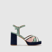 A single women's platform sandal with a chunky block heel, featuring a mint green ankle strap, a navy blue heel and platform sole, and a color-blocked toe strap in mint green, white, and light pink.