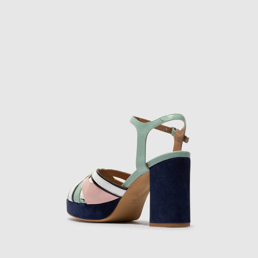 Multicolored sandal with a wooden sole on a light gray background