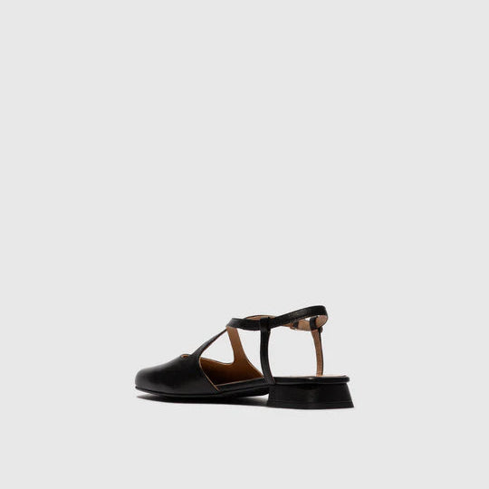 Black slingback with a thin strap on a light gray background