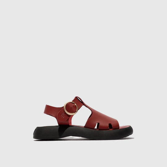 red sandal with a black sole on a light gray background