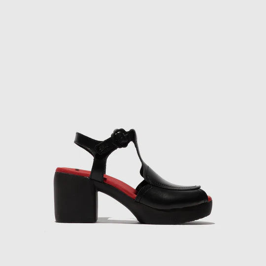 Black sandal with red sole on a light gray background