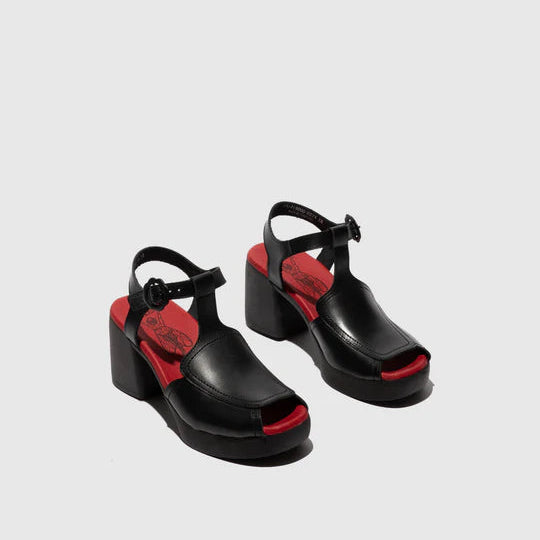 Black sandals with red accents on a light gray background