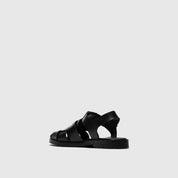 Black sandal on a light gray background