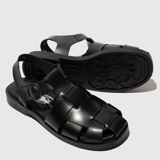 Black sandals with woven straps on a light gray background