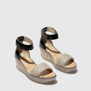 Pair of wedge sandals with quilted design 