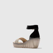 Black wedge sandal on a white background