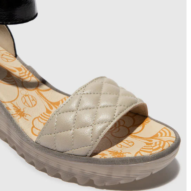 Quilted sandal with a wedge sole 