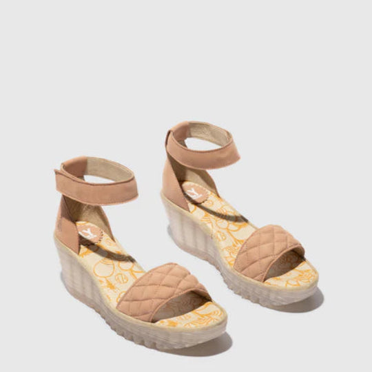 Pair of pink suede wedge sandals with quilted design